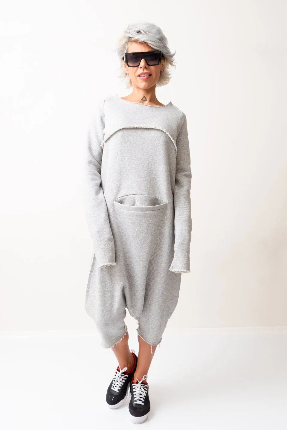 GREY OVERSIZED SLEEVELESS JUMPSUIT PAIRED WITH A TOP WITH LONG SLEEVES
