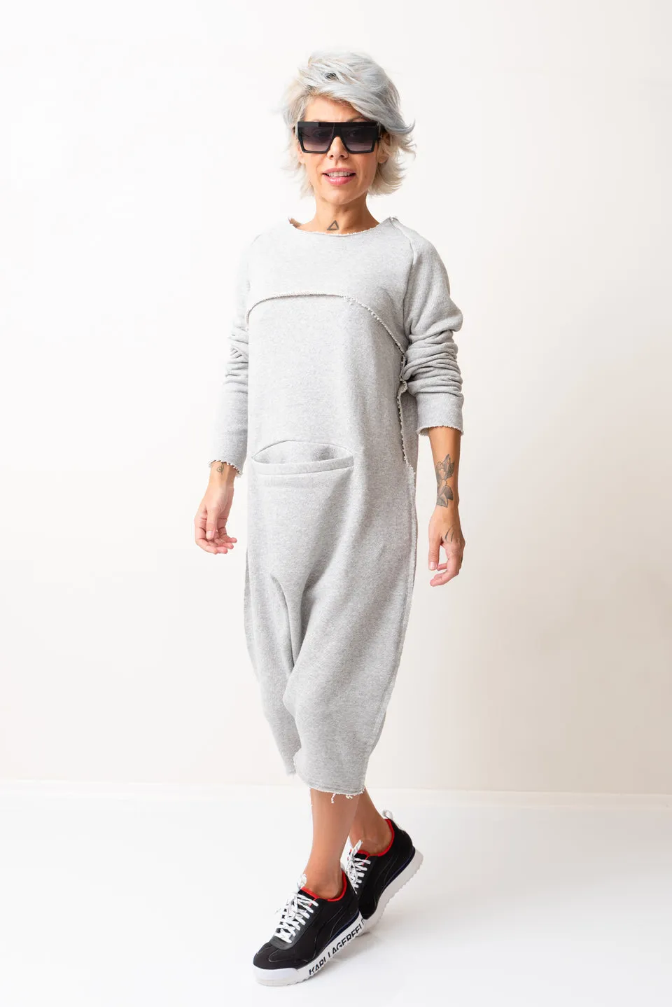 GREY OVERSIZED SLEEVELESS JUMPSUIT PAIRED WITH A TOP WITH LONG SLEEVES